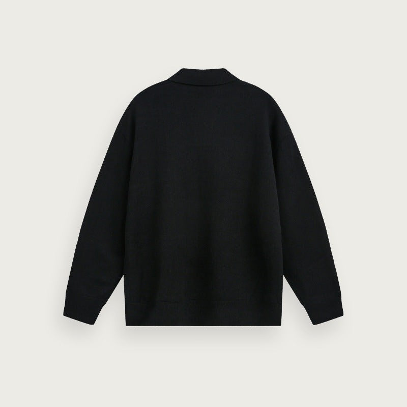 Enfärgad stickad polotröja – Avslappnad passform