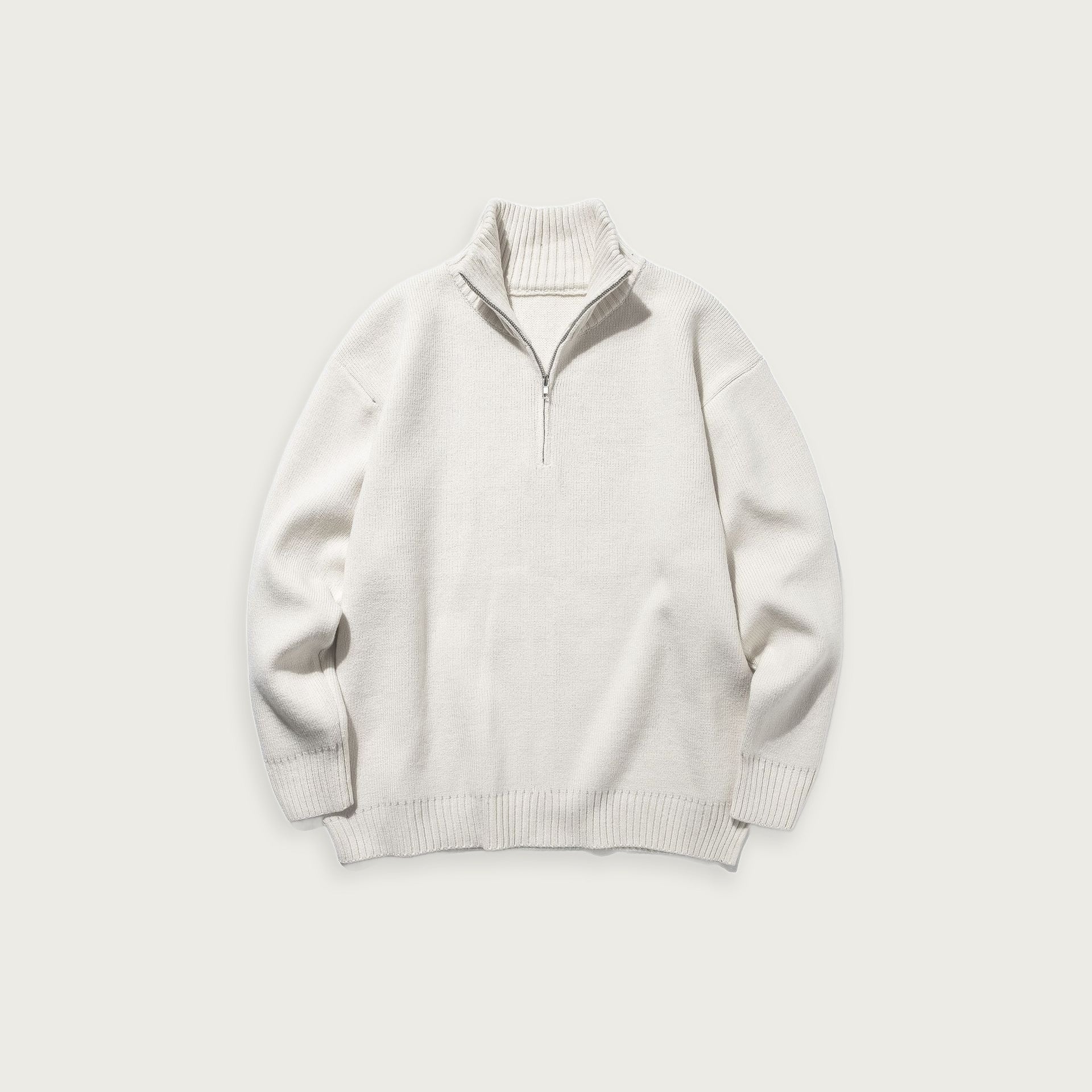 Enfärgad stickad halvpolo – Minimalistisk design