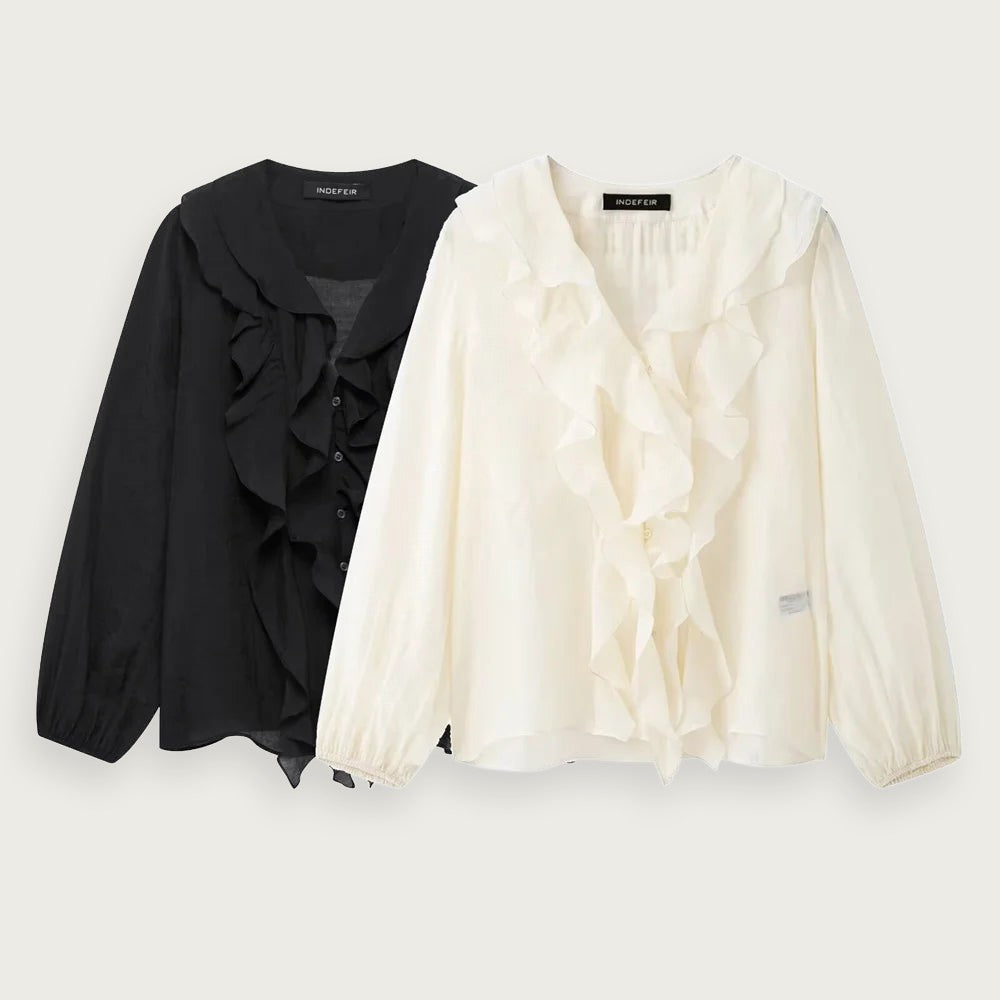 Blus med volanger och V-ringning – elegant design med puffärmar